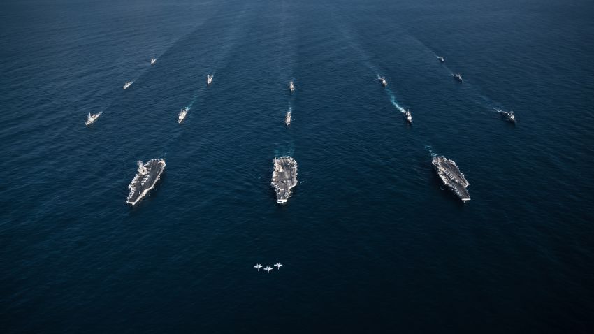 171112-N-TQ088-1754 
WESTERN PACIFIC (Nov. 12, 2017) Three F/A-18E Super Hornets, assigned to the Eagles of Strike Fighter Attack Squadron (VFA) 115, fly in formation over the aircraft carriers USS Ronald Reagan (CVN 76), USS Theodore Roosevelt (CVN 71), USS Nimitz (CVN 68) and their strike groups along with ships from the Republic of Korea Navy as they transit the Western Pacific. The strike groups are underway and conducting operations in international waters as part of a three-carrier strike force exercise. The U.S. Navy has patrolled the Indo-Asia Pacific region routinely for more than 70 years promoting regional security, stability and prosperity. (U.S. Navy photo by Lt. Aaron B. Hicks/Released)