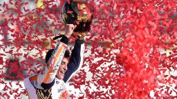 TOPSHOT - Repsol Honda Team's Spanish rider Marc Marquez celebrates after the MotoGP race of the Valencia Grand Prix at Ricardo Tormo racetrack in Cheste, near Valencia on November 12, 2017. 
Spain's Marc Marquez sealed his sixth world championship and fourth in the premier MotoGP category with third place at the Valencia Grand Prix. Marquez's Honda teammate Dani Pedrosa won the race from France's Johann Zarco in second.
 / AFP PHOTO / JOSE JORDAN        (Photo credit should read JOSE JORDAN/AFP/Getty Images)
