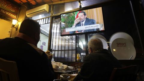 Lebanese watch an interview with Lebanon's resigned prime minister Saad Hariri at a coffee shop in Beirut on November 12, 2017.
