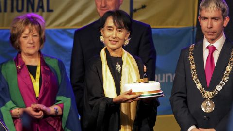 Suu Kyi holds a birthday cake at the ceremony where she received the "Freedom of the City of Dublin" award in Dublin in June 2012.