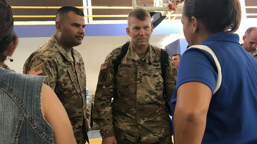 Lieutenant General Jeffrey Buchanan (center) discusses needs at a relief distribution center in Maricao, Puerto Rico.
