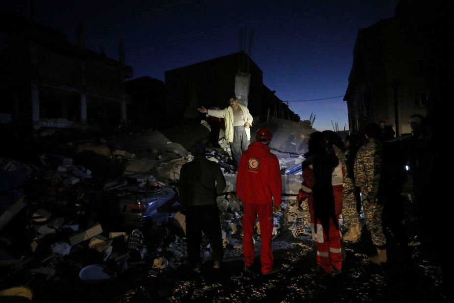 Rescue crews search through the rubble in Sarpol-e Zahab on November 13.