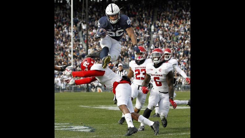 Penn State running back Saquon Barkley hurdles a Rutgers player during a college football game in State College, Pennsylvania, on Saturday, November 11. Barkley had two touchdowns in his team's 35-6 victory.