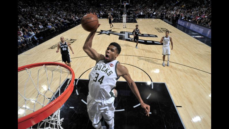 Milwaukee forward Giannis Antetokounmpo dunks the ball during an NBA game in San Antonio on Friday, November 10. He had 28 points in the Bucks' 94-87 victory, and as of Monday he leads the league in scoring (31.7 points per game). 