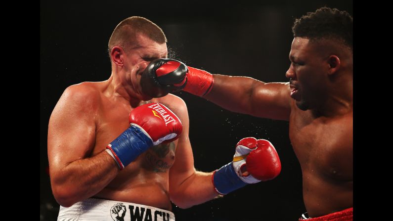 Jarrell Miller punches Mariusz Wach during a heavyweight bout in Uniondale, New York, on Saturday, November 11. Miller stopped Wach in the ninth round to remain undefeated.<br />