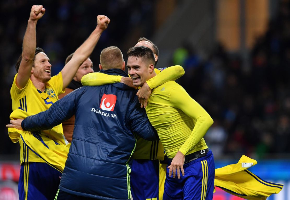 Sweden's players celebrate after qualifying for the World Cup for the first time since 2006