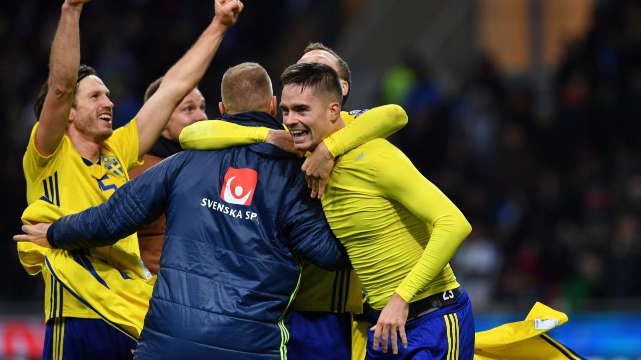 Sweden's players celebrate after qualifying for the World Cup for the first time since 2006