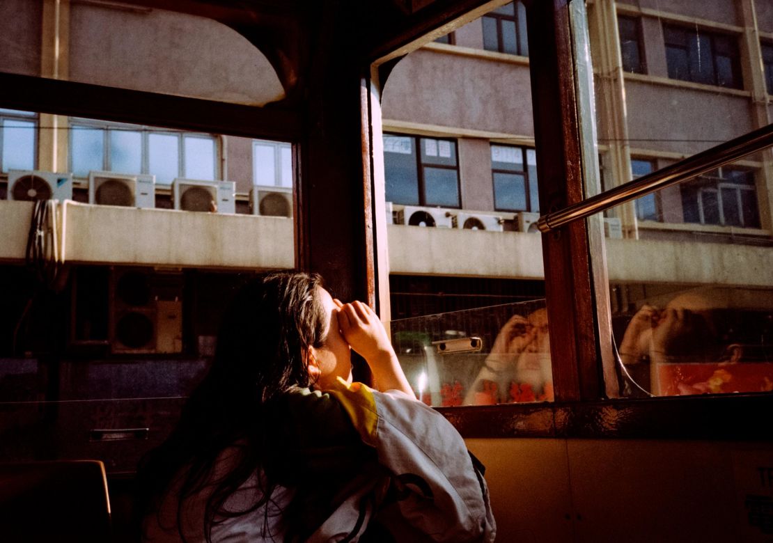 Caged Bird: Golden hour on the tram.