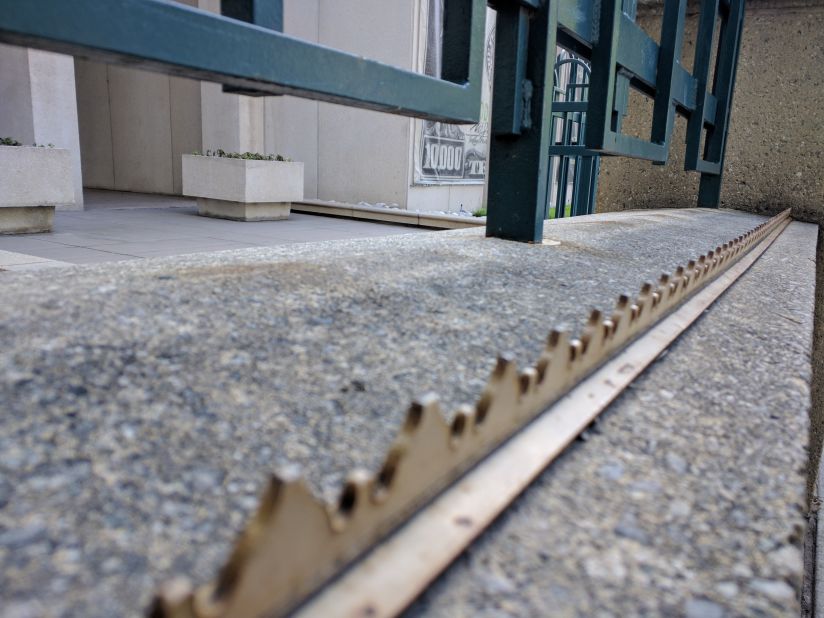 The Federal Reserve Bank of Denver, surrounded by fences and spikes. 