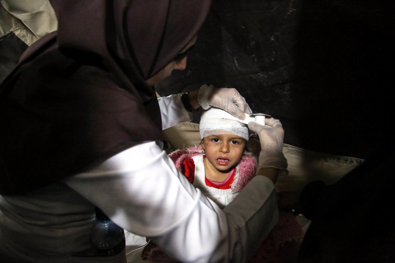 A wounded child receives medical treatment at a hospital in Sarpol-e Zahab on Monday, November 13.