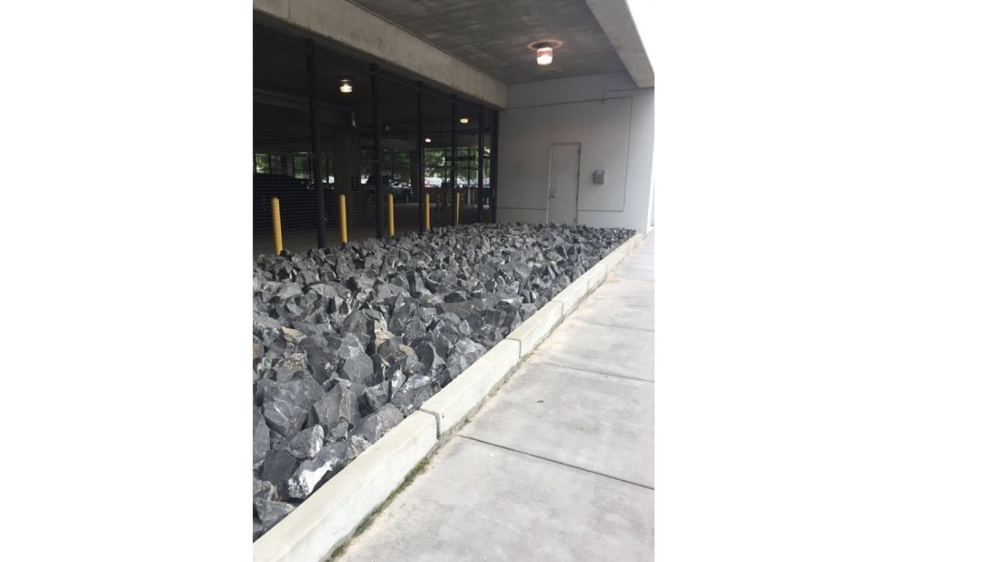 Countless stones have been placed outside this car park -- the sharp rocks make it impossible for homeless people to camp here.