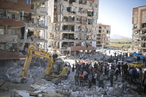 Rescuers use machinery to search for survivors in Sarpol-e Zahab on November 14.