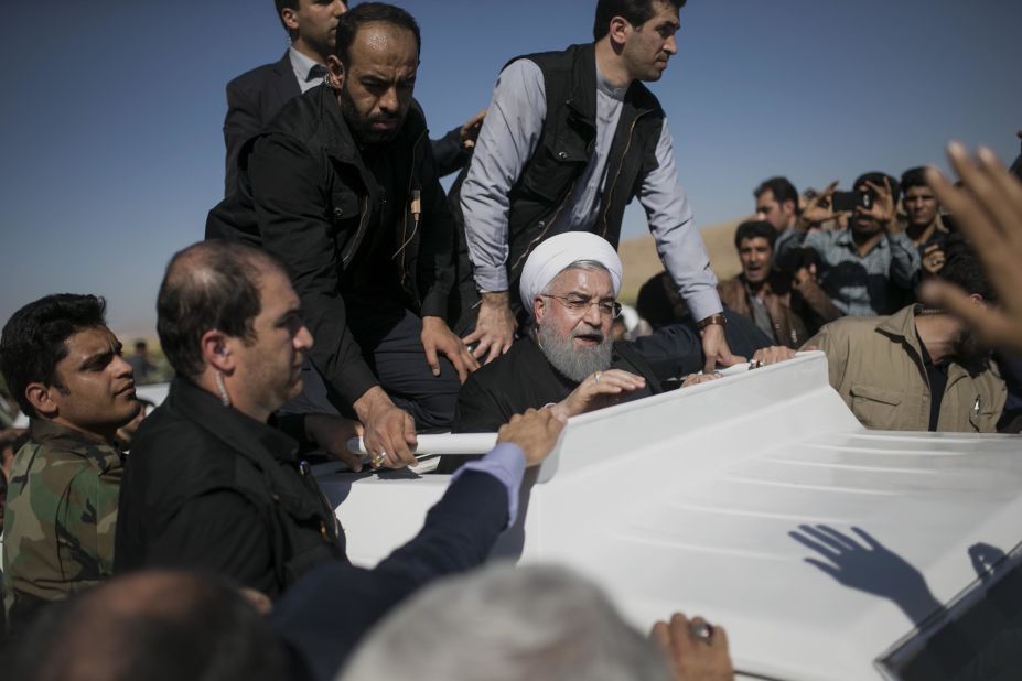 Iranian President Hassan Rouhani, center, visits those affected by the quake in Sarpol-e Zahab on November 14.