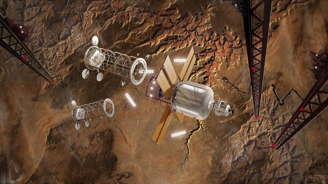 "I would like to see settlements on the moon in my lifetime -- and I am 53 years old now," he told CNN. A rendering shows spacecrafts in the low-earth orbit with the Grand Canyon in the background.