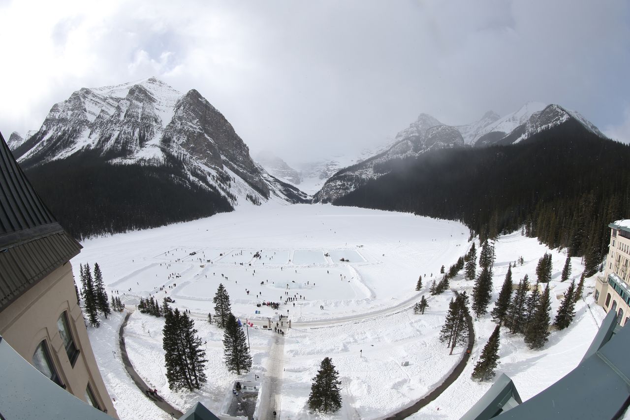An annual ice hockey tournament takes place on the frozen lake outside the Chateau Lake Louise.