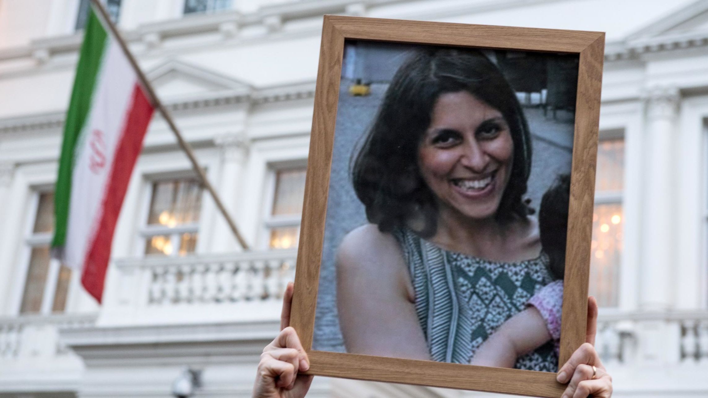 Supporters hold a photo of Nazanin Zaghari-Ratcliffe during a vigil for the British-Iranian mother outside the Iranian Embassy in London, in January 2017.