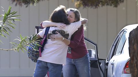 Women embrace outside Rancho Tehama Elementary School following Tuesday's incident.