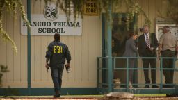 FBI agents are seen behind yellow crime scene tape outside Rancho Tehama Elementary School after a shooting in the morning on November 14, 2017, in Rancho Tehama, California
Four people were killed and nearly a dozen were wounded, including several children, when a gunman went on a rampage at multiple locations, including a school in rural northern California. / AFP PHOTO / Elijah Nouvelage        (Photo credit should read ELIJAH NOUVELAGE/AFP/Getty Images)