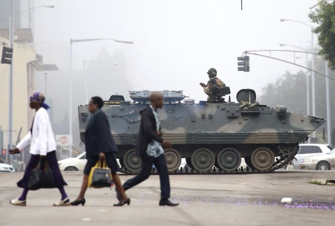 An armored vehicle patrols a street in Harare on Wednesday, November 15. In a dramatic televised statement, an <a href="index.php?page=&url=http%3A%2F%2Fwww.cnn.com%2F2017%2F11%2F14%2Fafrica%2Fzimbabwe-military-chief-treasonable-conduct%2Findex.html">army spokesman denied that a military takeover was underway,</a> but the situation bore all the hallmarks of one. The military said Mugabe and his family were "safe."