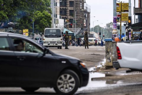 Soldiers monitor traffic in Harare on November 15 as the military set up checkpoints at key locations in the city.