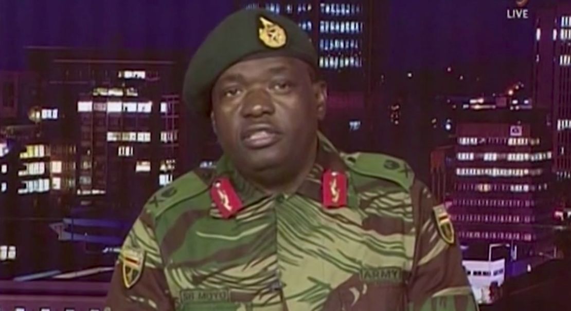 Maj. Gen. S.B. Moyo reads a statement during a TV broadcast on the Zimbabwe Broadcasting Corp.