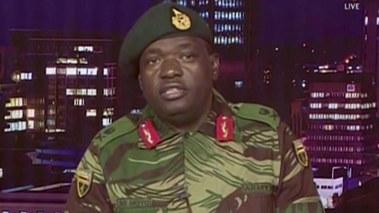 Maj. Gen. S.B. Moyo reads a statement during a TV broadcast on the Zimbabwe Broadcasting Corp.