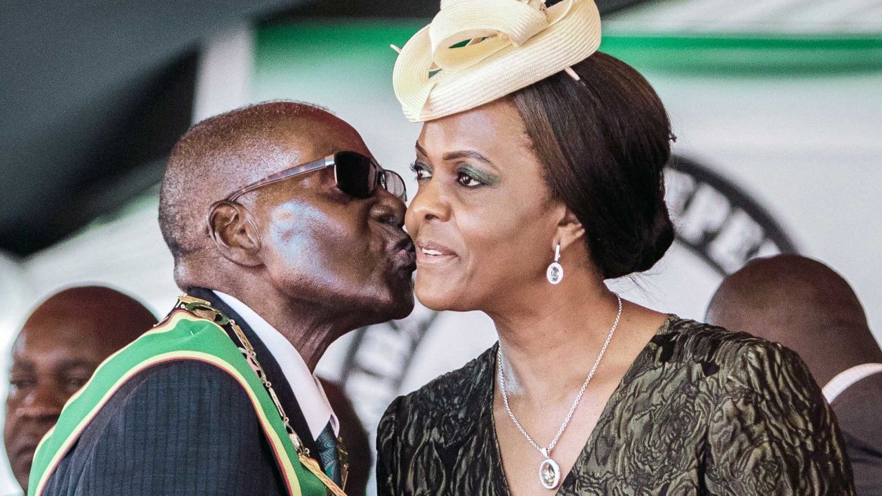 Robert Mugabe kisses his wife, Grace Mugabe, at Independence Day celebrations in Harare on April 18, 2017.