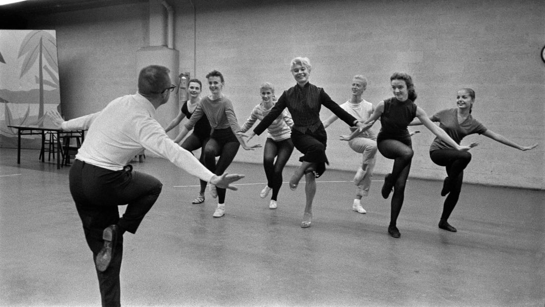 Channing, center, rehearses for a musical on CBS with choreographer Eugene Loring in 1957.