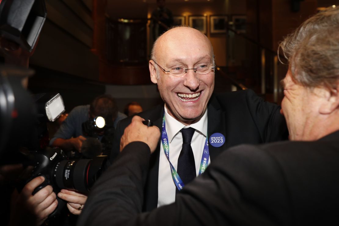 French rugby president Bernard Laporte celebrates after France is named 2023 Rugby World Cup host