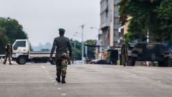 Zimbabwean soldiers stand at an intersection as they regulate traffic in Harare on November 15, 2017. 
Zimbabwe's military appeared to be in control of the country on November 15 as generals denied staging a coup but used state television to vow to target "criminals" close to President Mugabe. / AFP PHOTO / Jekesai NJIKIZANA        (Photo credit should read JEKESAI NJIKIZANA/AFP/Getty Images)