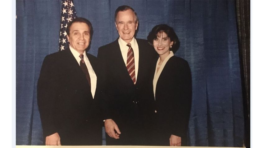 This image provided to CNN by the "Michigan woman" shows former President George H.W. Bush with the woman at a 1992 fundraiser. 