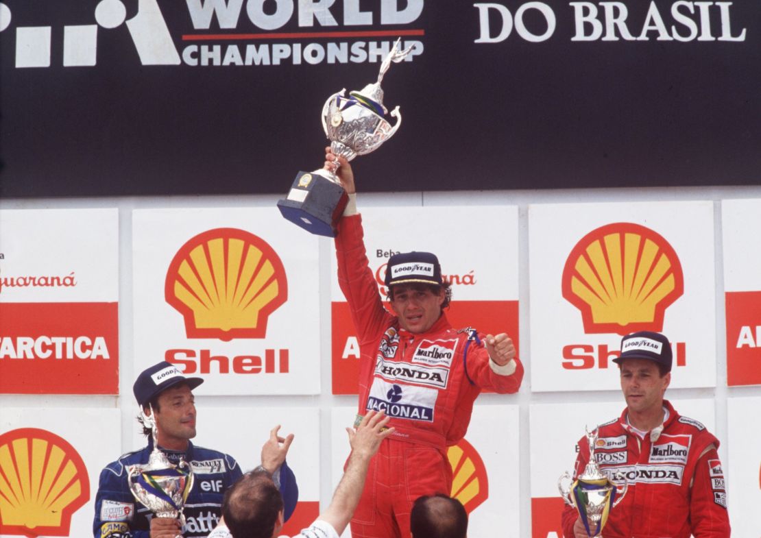 An exhausted Senna could hardly live the trophy after winning the 1991 Brazilian Grand Prix