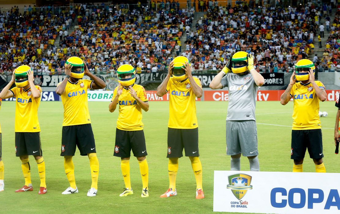Corinthians football team wear replicas of Senna's helmet on the eve of the 20th anniversary of his death