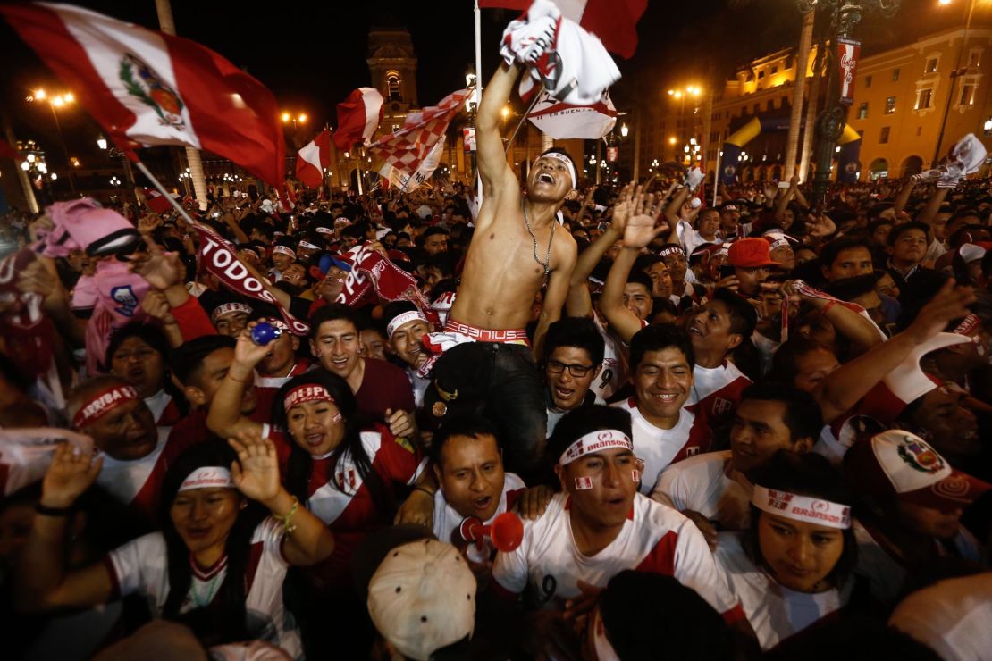 Supporters of Peru celebrate as their team beat New Zealand in the playoffs