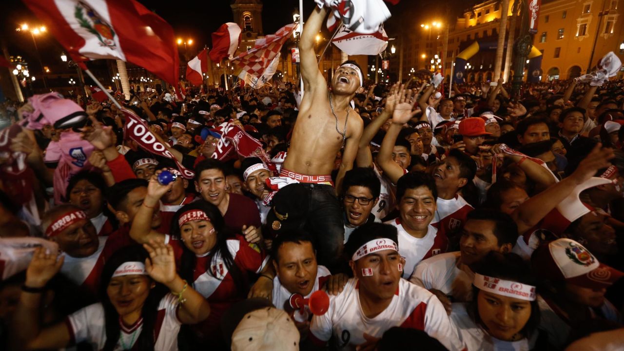 Supporters of Peru celebrate as their team beat New Zealand in the playoffs