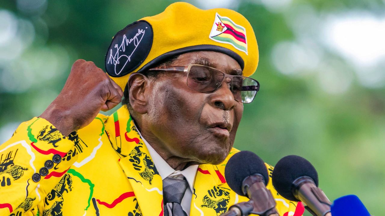 Zimbabwe's President Robert Mugabe addresses party members and supporters gathered at his party headquarters to show support to Grace Mugabe becoming the party's next Vice President after the dismissal of Emerson Mnangagwa November 8 2017.
Zimbabwe's sacked vice president, Emmerson Mnangagwa, said on November 8, 2017, he had fled the country, as he issued a direct challenge to long-ruling President Robert Mugabe and his wife Grace. / AFP PHOTO / Jekesai NJIKIZANA        (Photo credit should read JEKESAI NJIKIZANA/AFP/Getty Images)