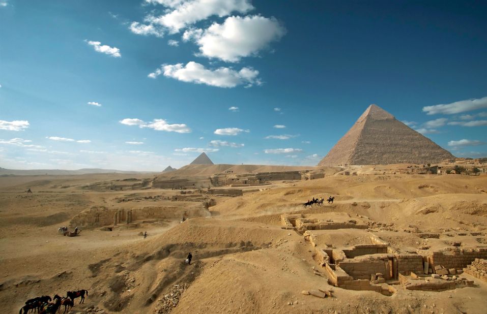 The pyramids of Khufu, Khafre and Menkaure were erected during the Old Kingdom of Ancient Egypt. Built on the Giza plateau bordering Cairo, the structures and their surrounding temples, cemeteries and workers' quarters -- some built thousands of years after the pyramids -- are of continued interest to Egyptologists. 