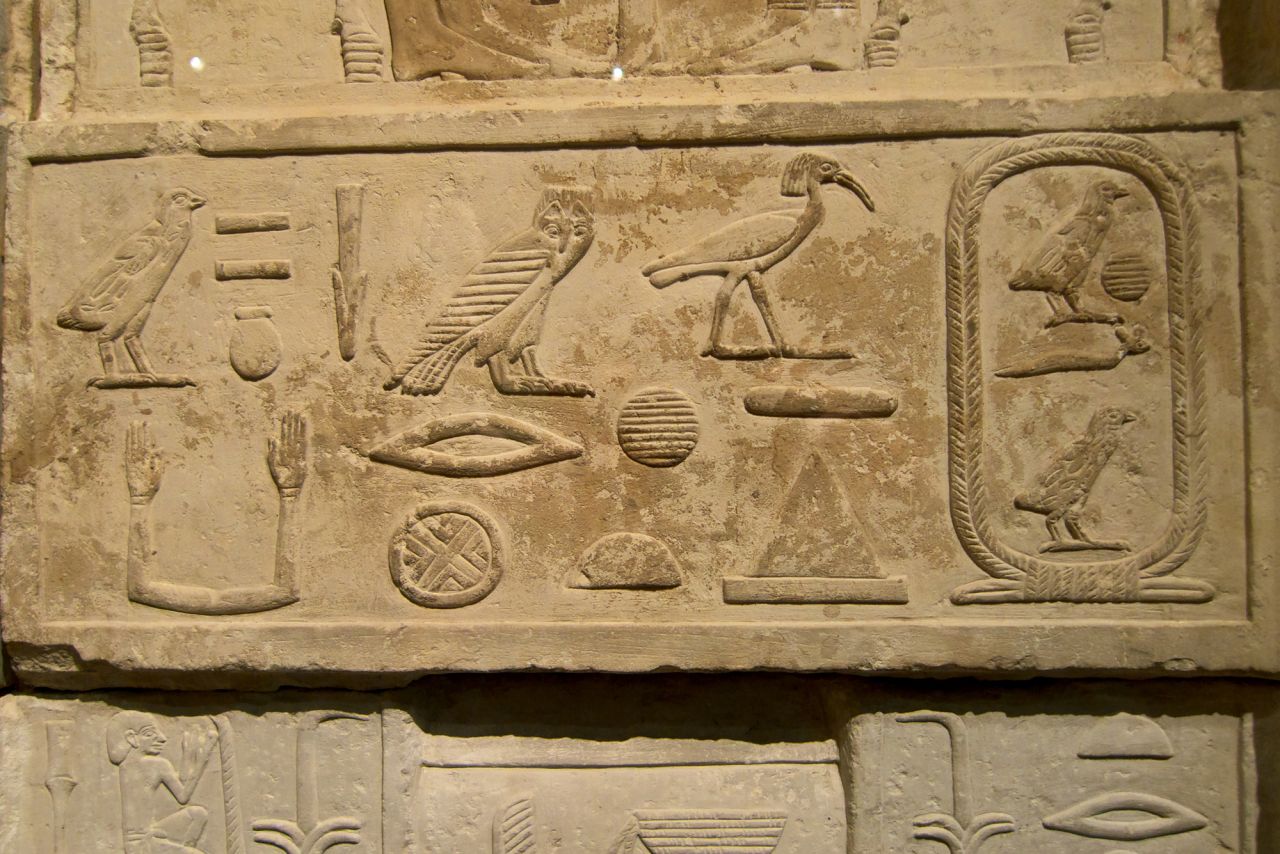 Hieroglyphs from the tomb of Senenuka, an architect from the time of Khufu. The name of Khufu can be seen within the oval shape to the right.