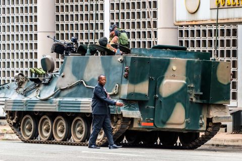 An armored vehicle is on patrol in Harare on November 16.