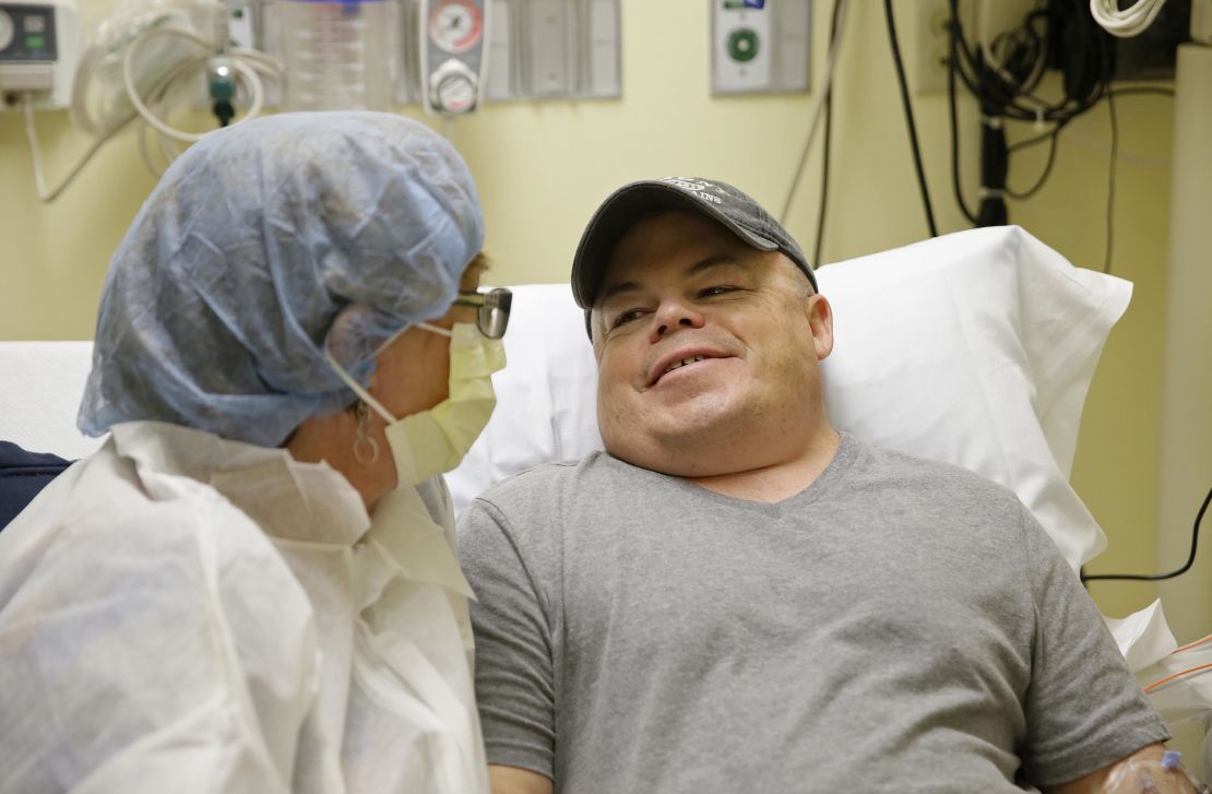 Brian Madeux sits with his girlfriend Marcie Humphrey while waiting to receive the first human gene editing therapy at the UCSF Benioff Children's Hospital in Oakland, California.