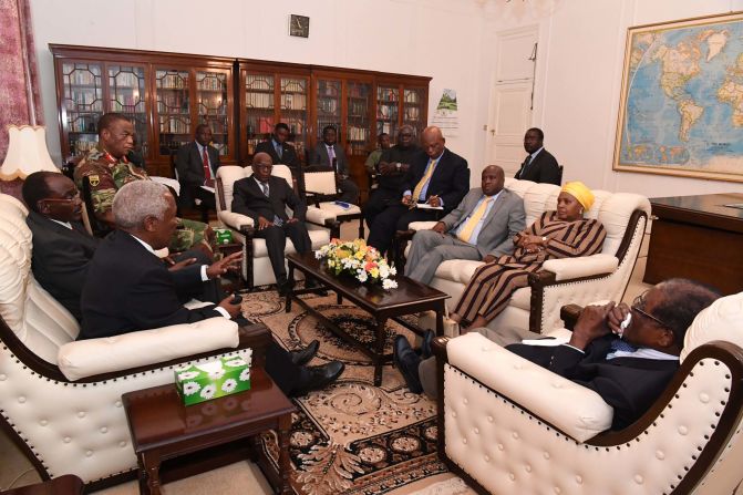 Mugabe, right, is seen in talks about his future in this image <a href="index.php?page=&url=https%3A%2F%2Ftwitter.com%2Fcaesarzvayi%2Fstatus%2F931198110575054848" target="_blank" target="_blank">tweeted by Caesar Zvayi,</a> the editor of The Herald newspaper, on Thursday, November 16.