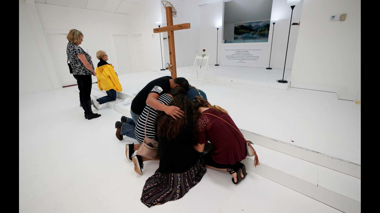 People pray in the First Baptist Church of Sutherland Springs, Texas, which was <a href="http://www.cnn.com/2017/11/13/us/inside-first-baptist-church/index.html" target="_blank">opened up as a memorial</a> on Sunday, November 12. Earlier this month, 25 people and an unborn child were killed in a shooting attack at the church.