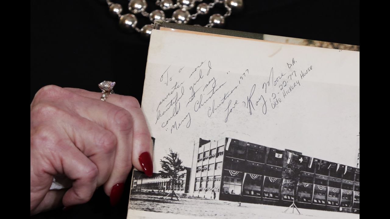 Beverly Young Nelson shows an inscription in her high school yearbook Monday, November 13, during <a href="http://www.cnn.com/2017/11/13/politics/gloria-allred-roy-moore-alabama/index.html" target="_blank">a news conference in which she accused Roy Moore,</a> a US Senate candidate, of sexually assaulting her when she was a teenager. Moore called the accusation "absolutely false" in a statement, denying that he knew Nelson. Nelson's accusations came after The Washington Post published <a href="https://www.washingtonpost.com/investigations/woman-says-roy-moore-initiated-sexual-encounter-when-she-was-14-he-was-32/2017/11/09/1f495878-c293-11e7-afe9-4f60b5a6c4a0_story.html" target="_blank" target="_blank">a bombshell report</a> that said Moore pursued relationships with teenage women while he was in his 30s. One woman said she was 14 years old when Moore initiated sexual contact with her. Moore has denied the allegations in the report.