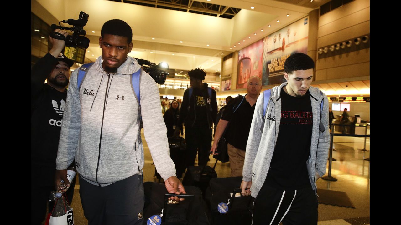 UCLA basketball players Cody Riley, left, and LiAngelo Ball, right, leave Los Angeles International Airport after returning home from China on Tuesday, November 14. Riley, Ball and Jalen Hill -- seen at center in the background -- had been arrested ahead of the team's season opener in Shanghai. They were questioned on suspicion of stealing sunglasses from a Louis Vuitton store near their hotel. School officials said the charges were withdrawn by Chinese authorities after the players admitted guilt, and the players <a href="http://www.cnn.com/2017/11/15/sport/ucla-basketball-players-statements/index.html" target="_blank">publicly apologized</a> during a news conference back home.
