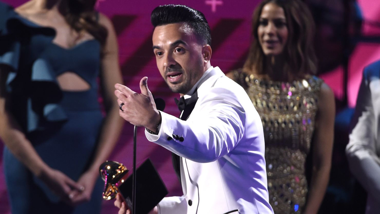 Luis Fonsi accepts the record of the year award for "Despacito" on Thursday night at the Latin Grammys.