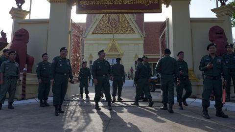 Cambodian police officials stand guard during a hearing in front of the Supreme Court building in Phnom Penh on November 16, 2017.