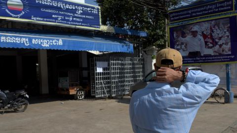 A man walks past the opposition Cambodia National Rescue Party (CNRP) headquarters in Phnom Penh on  Thursday.