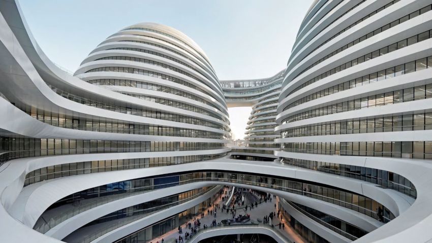 A modern Beijing landmark, Galaxy SOHO offers another example of Hadid's signature curves. They flow down from the building's four towers to a subterranean courtyard that was inspired by traditional Chinese architecture.
