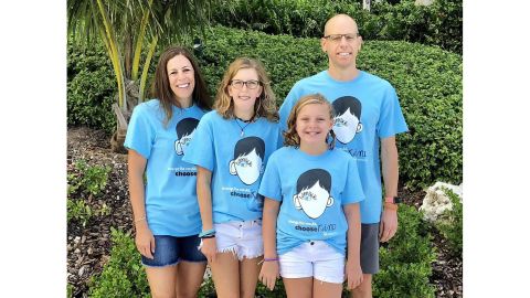 Emily Merrill, 13, with her parents, Nancy and Gary, and her sister, Abigail.