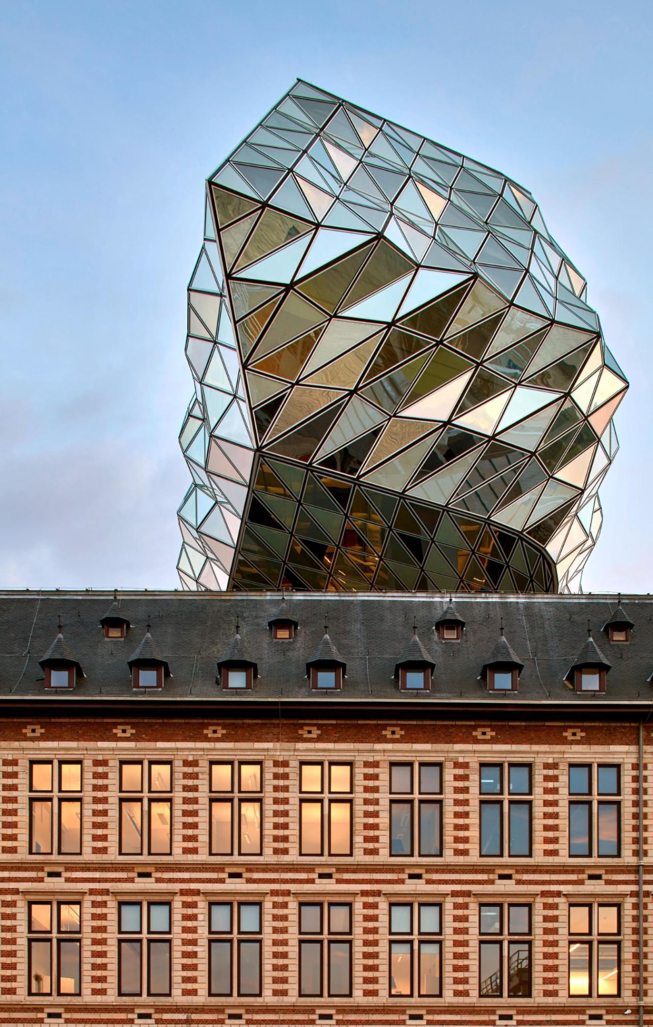 The building's 2,000 triangular glass panels nod to Antwerp's history as a diamond trading city.